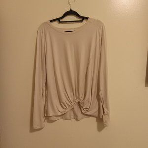Long-sleeved, cream-colored blouse